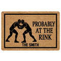 Wrestling doormat with two grapplers in headgear, bold black border, and humorous entryway artwork
