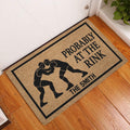 Wrestling doormat styled at a front door on hardwood flooring with grappler artwork and bold lettering