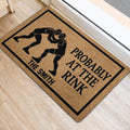 Wrestling entryway mat displayed beside a doorway with two grapplers and bold black graphic details