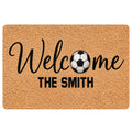 Soccer-themed doormat with a black-and-white soccer ball, welcome lettering and family-style entryway design
