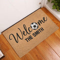 Soccer welcome doormat displayed inside a home entryway on warm wood flooring