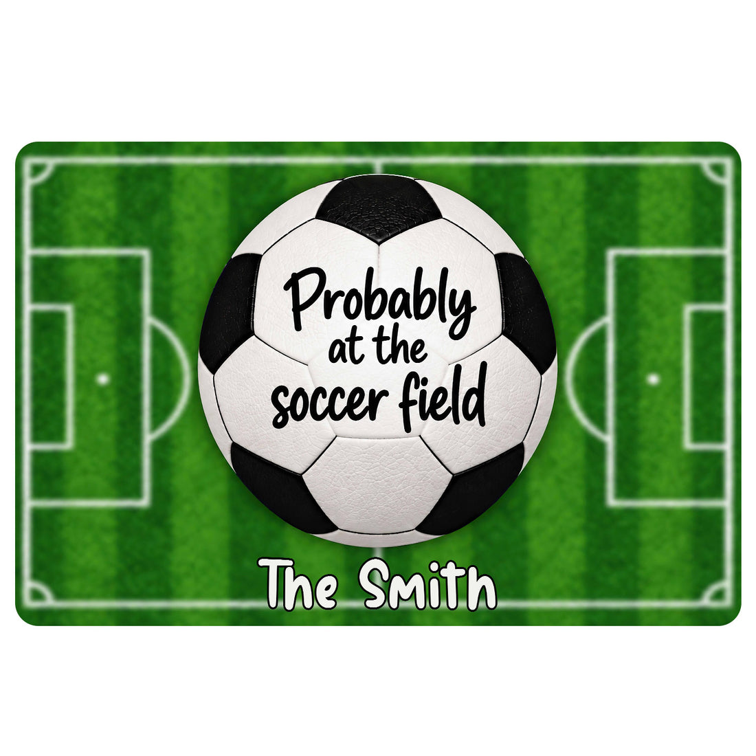 Soccer doormat with a black and white ball over a green field and playful lettering