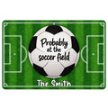 Soccer doormat with a black and white ball over a green field and playful lettering