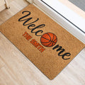 Basketball-themed welcome mat positioned by a doorway on a light wood floor