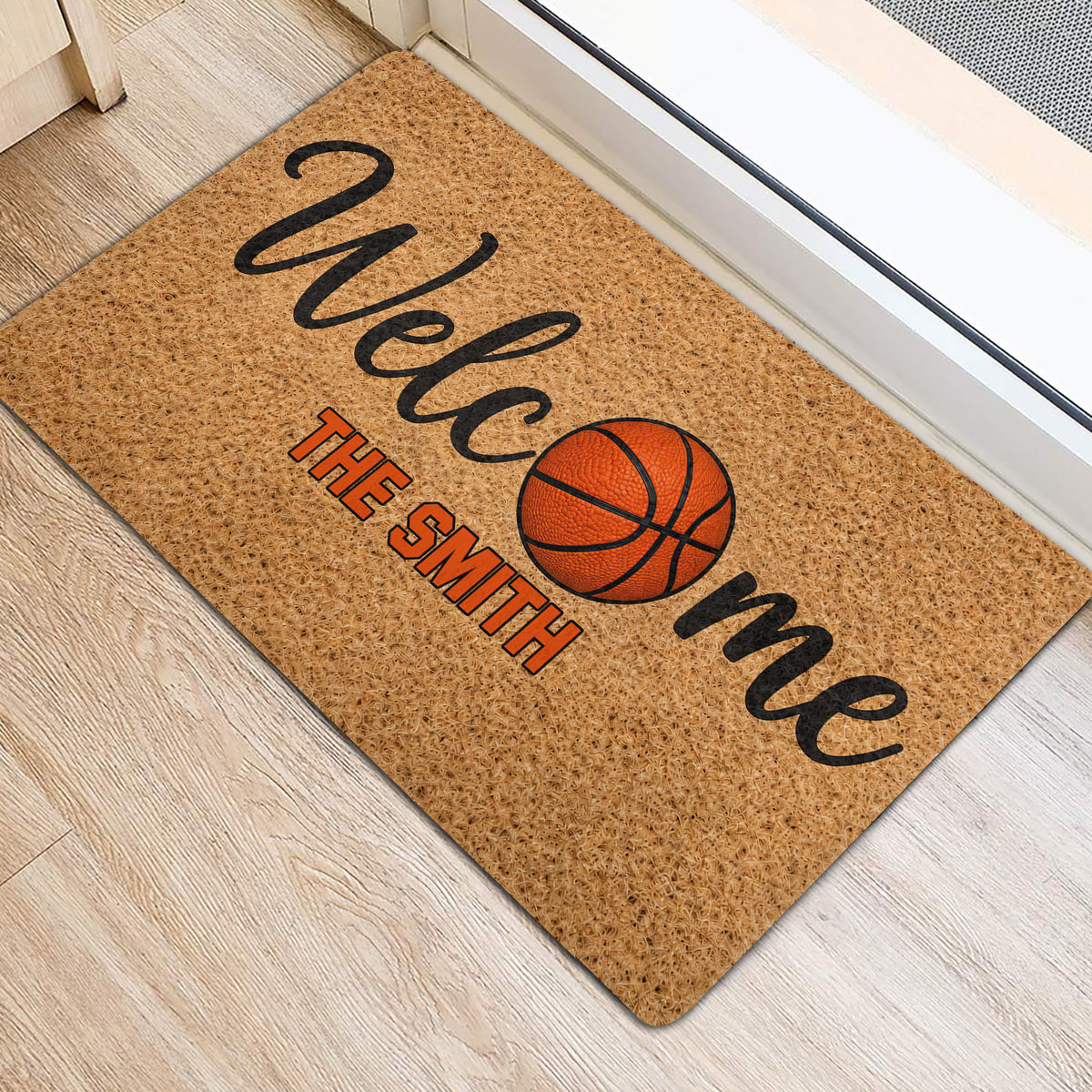 Basketball-themed welcome mat positioned by a doorway on a light wood floor