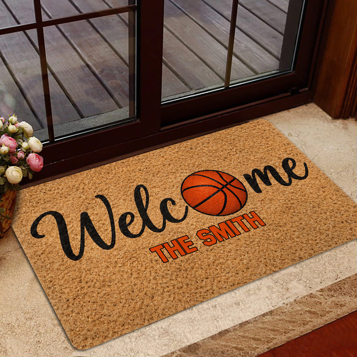 Basketball welcome doormat styled near a glass entry door and indoor foyer