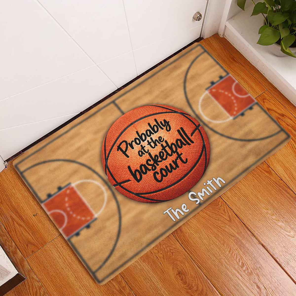 Basketball court doormat displayed at an indoor doorway on a warm wood floor
