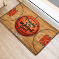 Basketball-themed entryway mat shown beside a doorway with court lines and orange hoops