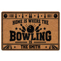 Bowling doormat with black bowling balls, pins, stars and bold vintage-inspired graphic artwork