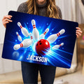 Bowling doormat held indoors, showing a red ball, white pins, and dynamic blue motion effects