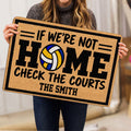 Volleyball doormat held indoors, featuring a colorful volleyball and bold black lettering