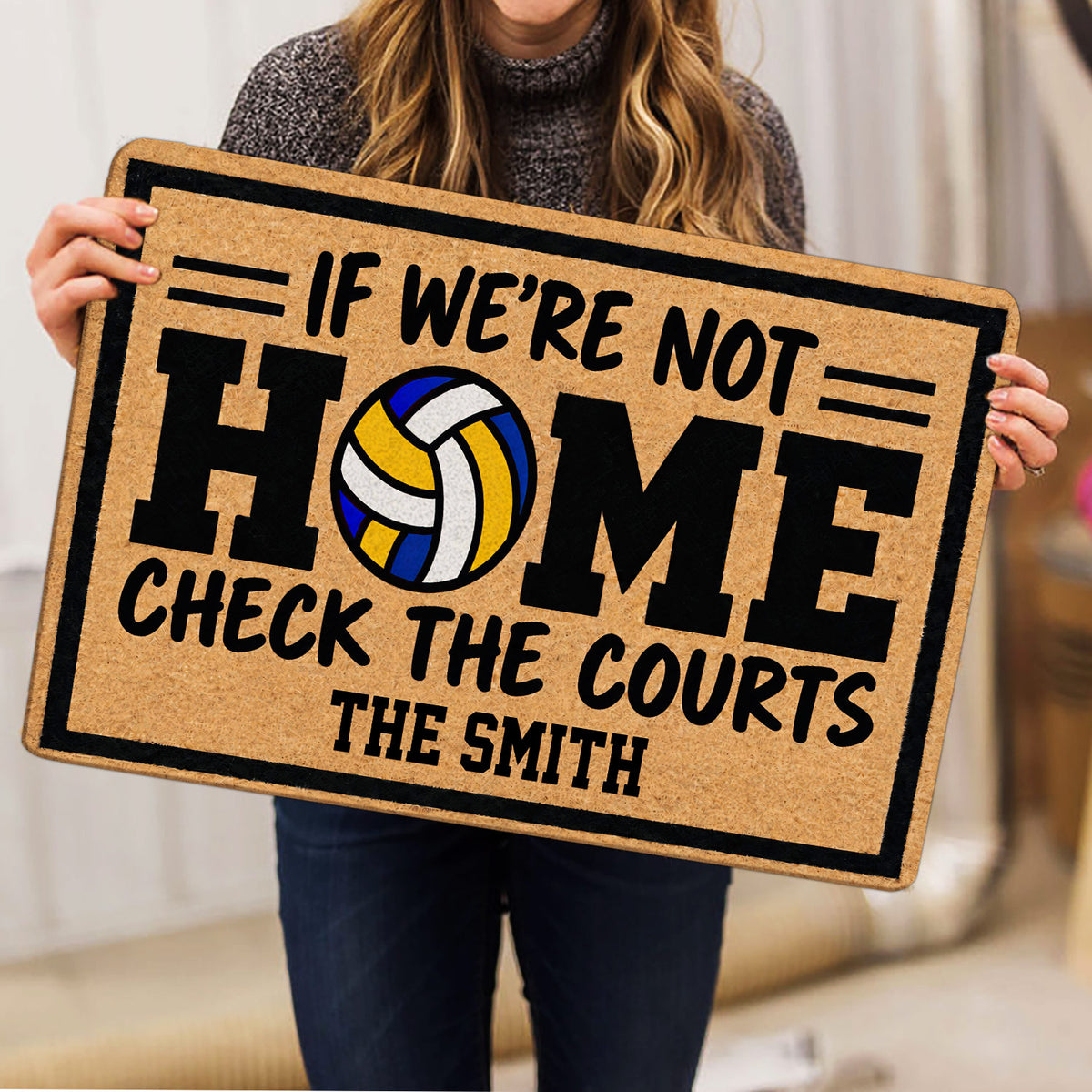 Volleyball doormat held indoors, featuring a colorful volleyball and bold black lettering
