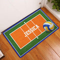 Colorful volleyball court doormat displayed in an indoor entryway beside a white door