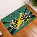Cheerleading doormat displayed in an entryway with pom-poms and megaphone artwork on a wood floor