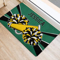Cheerleading door mat near a doorway featuring bold pom-poms, megaphone graphics, and athletic colors