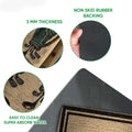 Close-up product detail showing the golf artwork, textured surface, rubber backing and slim mat profile
