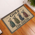 Golf doormat styled in an indoor entryway on a warm wood floor beside a white door