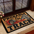 Dirt track racing entryway mat shown near a glass door with bold black, red and tan artwork