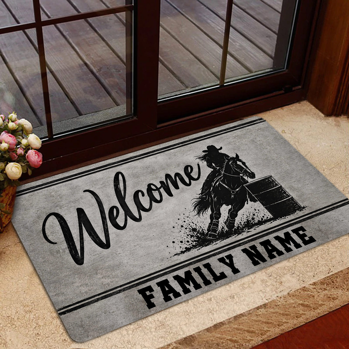 Barrel racing entryway mat displayed near glass doors with a horse, barrel, and welcome artwork