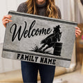 Barrel racing welcome doormat held indoors showing the horse and rider artwork in black and gray