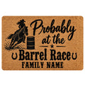 Barrel racing doormat with a mounted rider, racing barrel, horseshoes and bold western typography