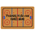 Hockey rink doormat with red and blue ice markings, faceoff circles, and bold central lettering