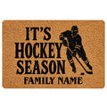 Hockey doormat with black skater silhouette, bold seasonal lettering, and family-focused entryway design