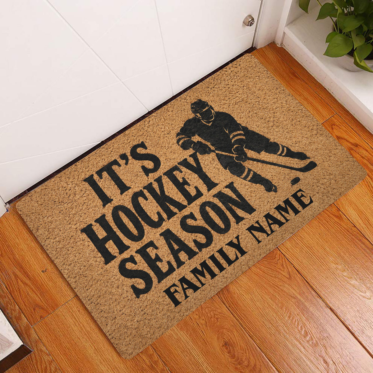 Hockey season doormat styled at an indoor front door with wood flooring and a bold skater design