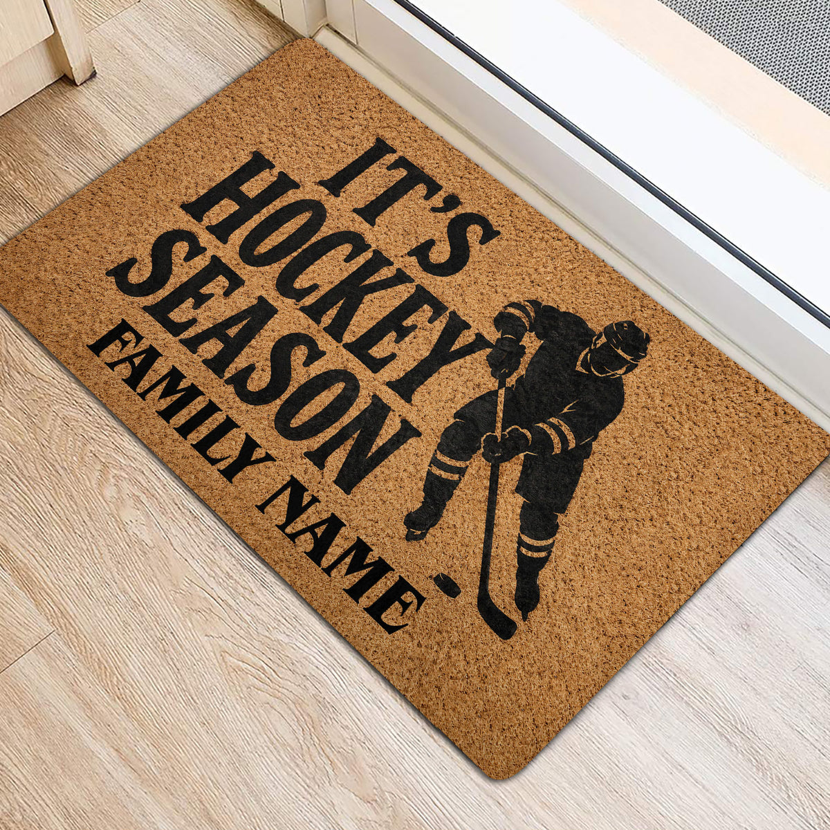 Hockey season entryway rug displayed beside a doorway with a black hockey player silhouette
