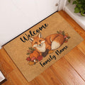 Autumn fox doormat displayed at a front door on hardwood flooring with pumpkins and colorful leaves