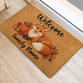Fox entryway mat beside a door featuring a cozy autumn design with pumpkins, mushrooms, acorns, and leaves