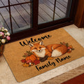 Fox welcome doormat styled inside a glass entryway door with autumn foliage and pumpkin artwork