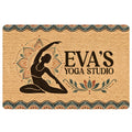 Yoga doormat with a meditating figure, lotus mandala artwork, earthy tones, and decorative teal border
