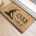 Yoga door mat styled at an indoor entrance with a meditating silhouette, botanical accents, and patterned border