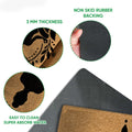 Feature detail showing the printed yoga artwork, textured top surface, and dark rubber backing of the doormat