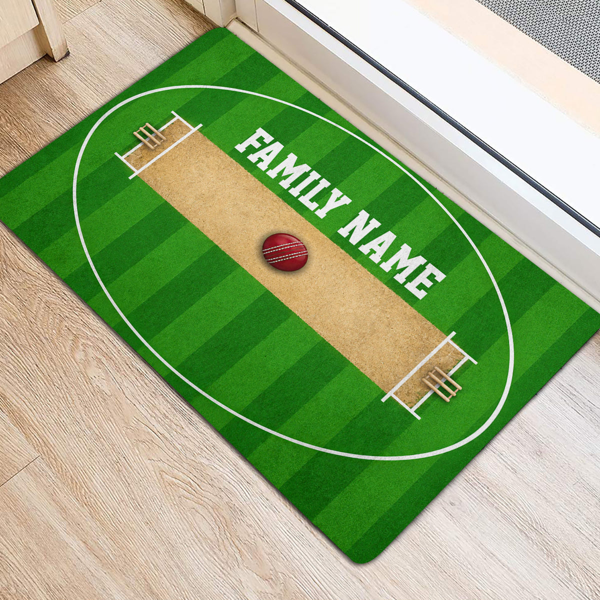Green cricket pitch door mat positioned near an entryway with a cricket ball design