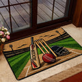 Cricket door mat styled at a home entrance with colorful bat, ball, wickets and field artwork