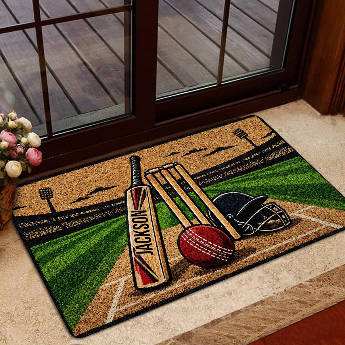 Cricket door mat styled at a home entrance with colorful bat, ball, wickets and field artwork