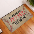 Baseball entryway rug shown beside a white door on warm wood flooring