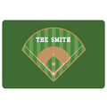 Green baseball doormat featuring a striped ballfield, tan infield, white baselines, and home plate