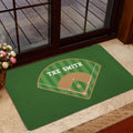 Green baseball entryway mat styled near a glass door with a ballpark diamond design