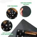 Close-up of police badge and distressed flag doormat surface with a dark rubber backing detail