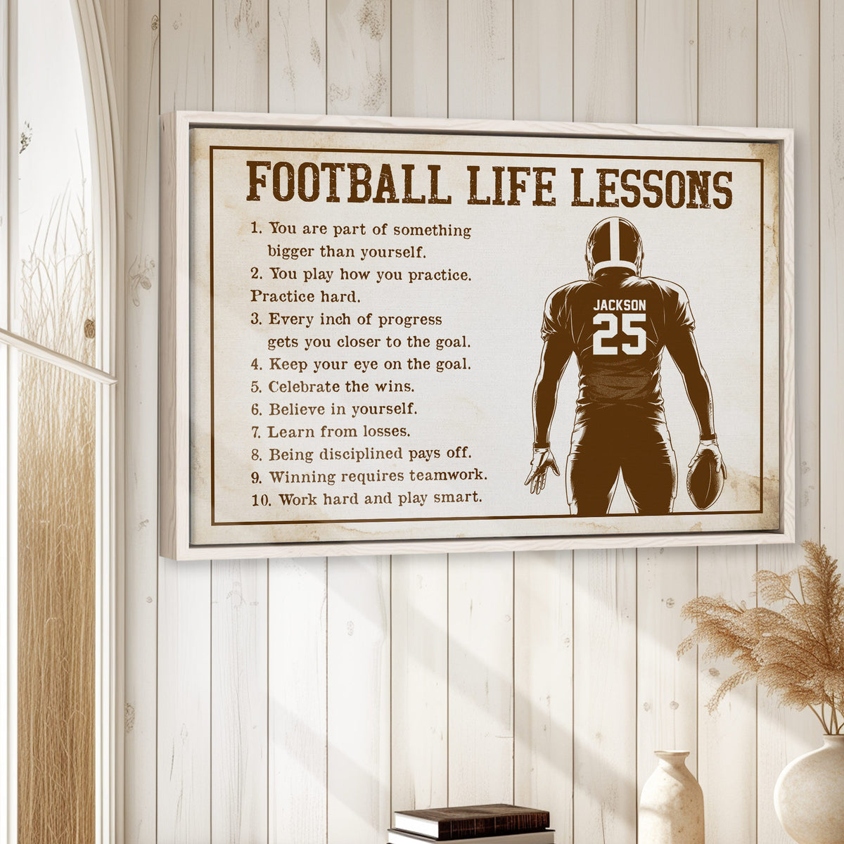 Football wall art displayed in a bright farmhouse-inspired room with white wood paneling