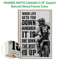 Framed matte canvas motocross wall art shown with a natural wood frame and dirt bike rider