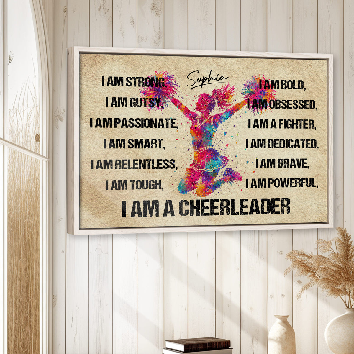 Cheerleading wall art displayed in a bright room with a colorful framed jumping cheerleader design