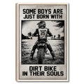 Framed motocross wall art showing a dirt bike rider crossing an outdoor field in bold black and white