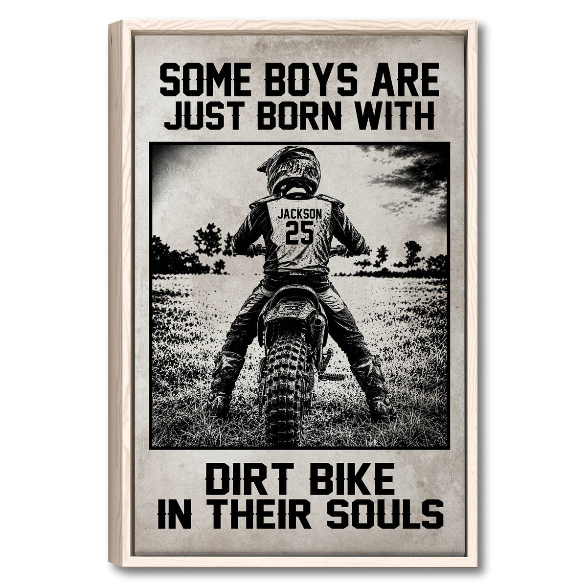 Framed motocross wall art showing a dirt bike rider crossing an outdoor field in bold black and white