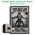 Black framed canvas motocross wall art with a dirt bike rider, monochrome artwork and bold typography