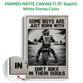 White framed canvas motocross wall art featuring a dirt bike rider in a high contrast outdoor scene