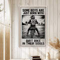Motocross wall art displayed on a light wood-paneled wall in a bright rustic home interior